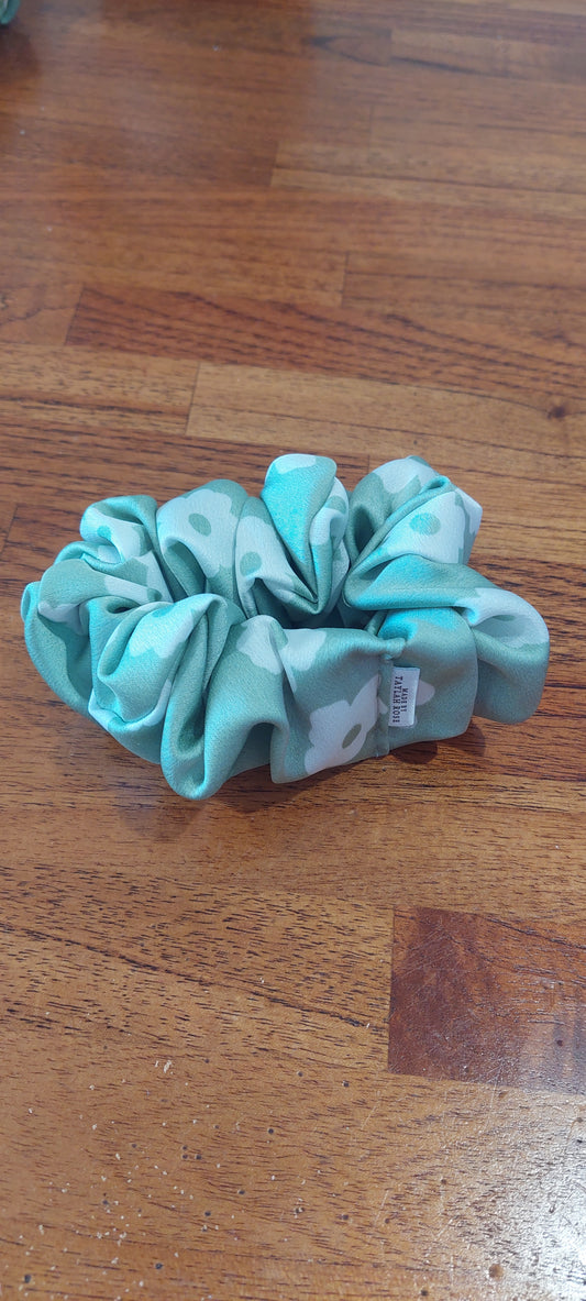 Green scrunchie with white flower